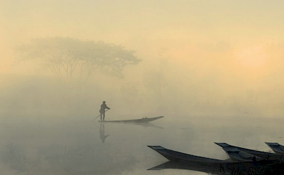 Boat at sunrise near Nyaungshwe, Burma. Photo by Tim Manning