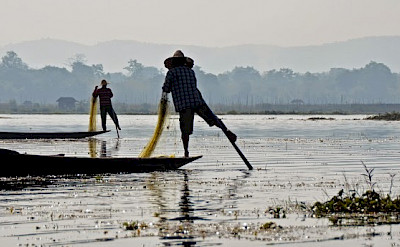 Fisherman on stilts in Inle Lake, Myanmar. Photo by Tim Manning