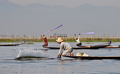 Slapping water on Inle Lake in Burma. Photo by Tim Manning