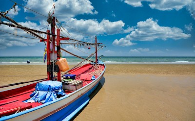 Colorful boat in Hua Hin, Thailand bike tour. Unsplash@Allphoto Bangkok