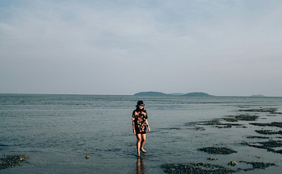 On the beach in Chumphon, Thailand bike tour. Unsplash@Thitipark Sodchuen