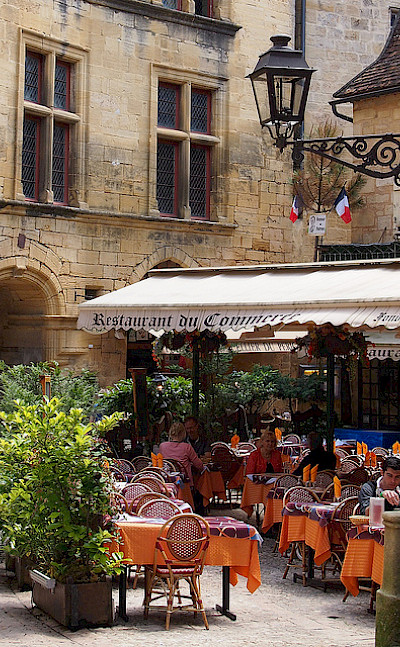 Off the bike for a cafe stop in Sarlat, France. Flickr:Mike Fleming