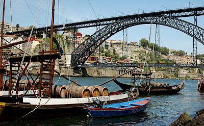Old wine barrel carrying vessels in Porto, Portugal. Photo via Flickr:Lau Svensson