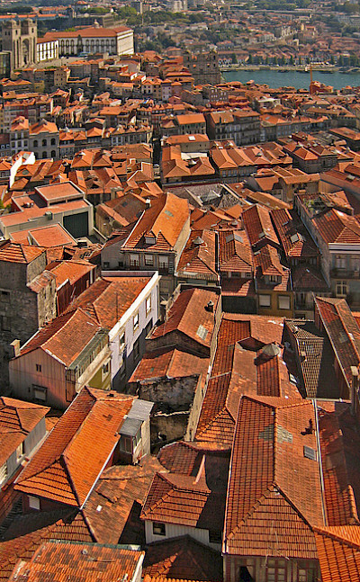 Rooftops in Porto along the Douro River, Portugal. Photo via Flickr:HarshilShah