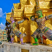 Saigon to Bangkok - Gleaming gold temple with colorful sculptures in Bangkok, Thailand bike tour. Unsplash@Worachat Sodsri