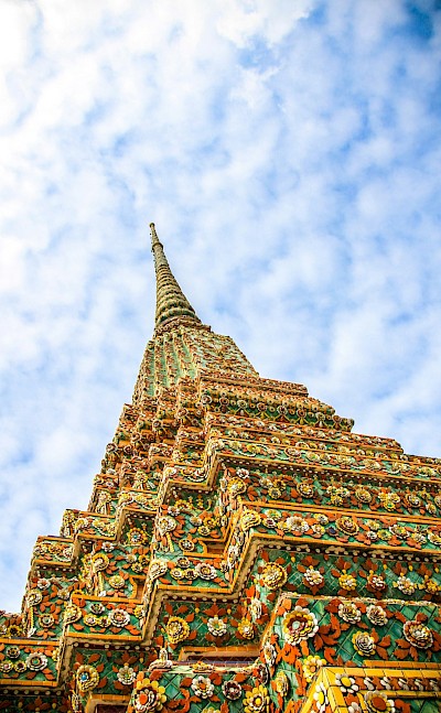 Ornate temple tower in Bangkok, Thailand bike tour. Unsplash@Vince