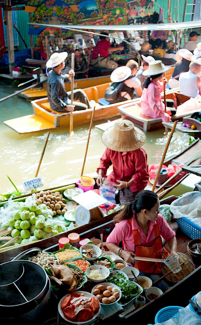 Ladies selling food at the Floating Market near Bangkok, Thailand. Flickr:Colin Tsoi