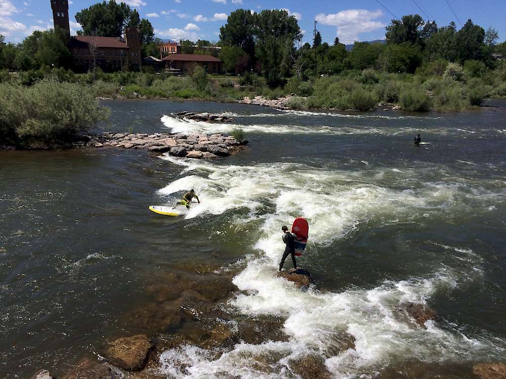 Surfing on the rapids near Caras Park on the Clark Fork River