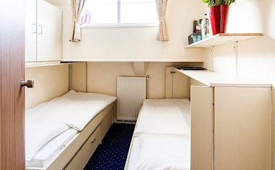 Lower Deck Twin Cabin with half height window. 2 twin beds, 1 folds up into the wall - Bordeaux | Bike & Boat Tours