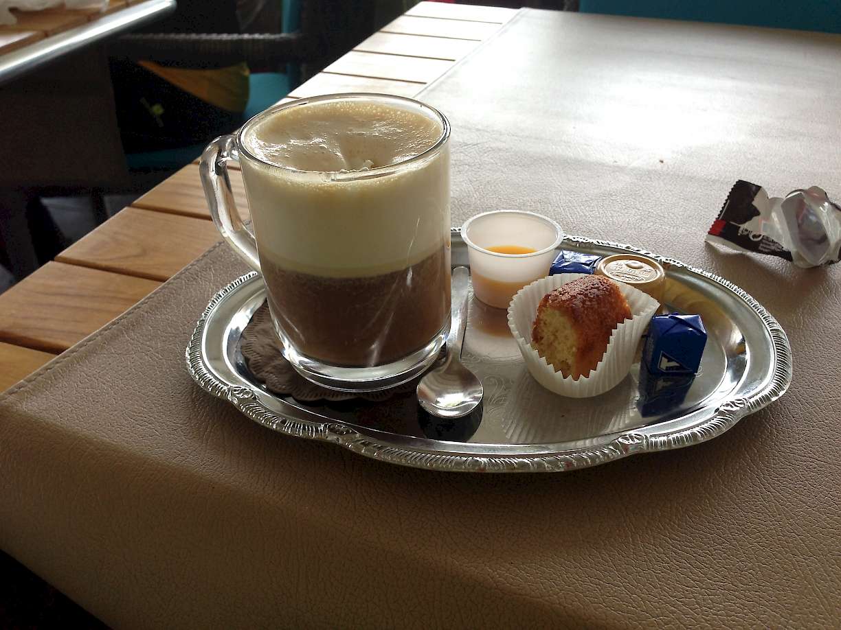 Classic European breakfast, Cappuccino and a sweet.
