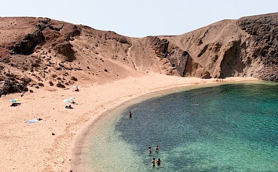 People swimming in the sea, Lanzarote, Spain. Unsplash@Alev Takil