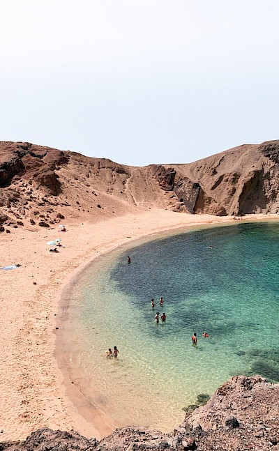 People swimming in the sea, Lanzarote, Spain. Unsplash@Alev Takil