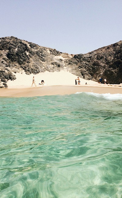 View of a beach from the sea, Lanzarote, Spain. Unsplash@Olga Mai