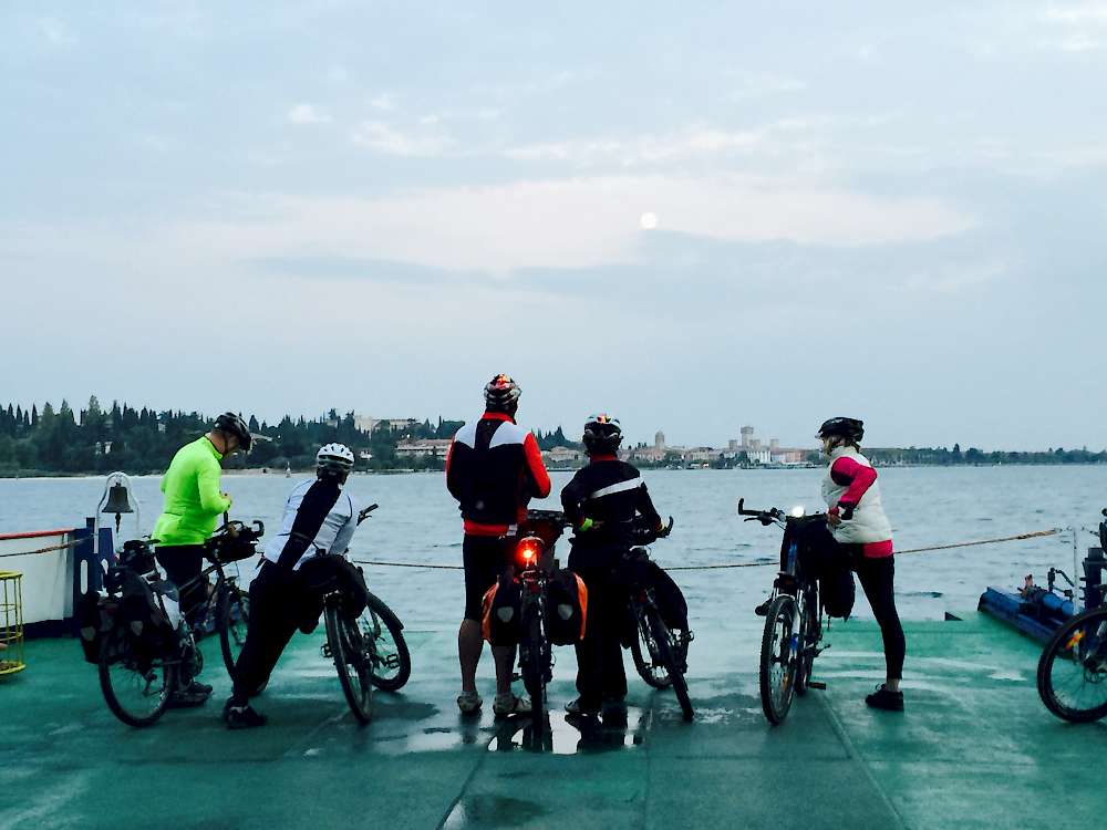 Approaching Sirmione. All the cyclists can’t wait to get off. And that is the moon in the sky!