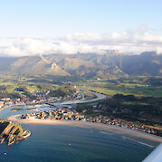 Basque Country to Asturias by E-Bike - Aerial of Ribadesella on the Cantabrian Sea, Asturias, Spain. Photo via Flickr:AsturZephyra