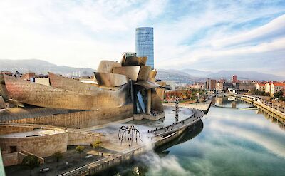 Clouds reflected in the river by the Guggenheim Museum, Bilbao, Spain. Unsplash:Jorge Fernandez Salas