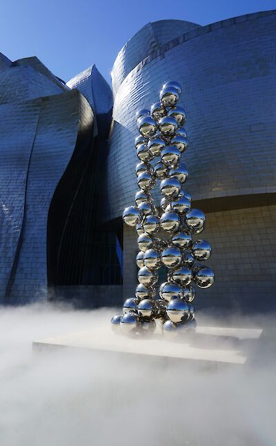 Mist around the base of a sculpture outside the Guggenheim Museum, Bilbao, Spain. Unsplash:Lucia Hernandez