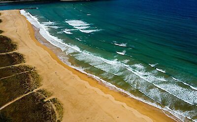 Beach at Villaviciosa, Spain. Unsplash:Alister Iglesias