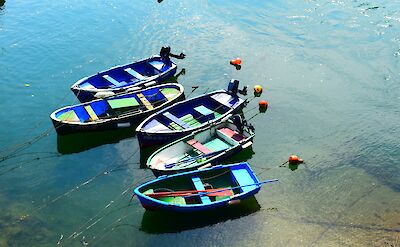 Colorful boats in San Vicente de la Barquera, Spain. Unsplash:Carlos Andres