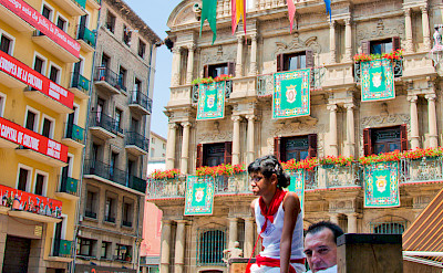 Running of the bulls in front of Pamplona's City Hall, Navarre, Spain. Photo via Flickr:Joe Van