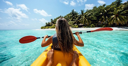 Kayaking around a tropical island. Unsplash@Roberto Nickson