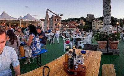 Dining seaside in Muggia, province Trieste, region Friuli-Venezia Giulia, Italy. Flickr:Oleg Brovko