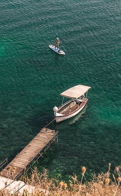 Beautiful Lake Ohrid borders Albania & Macedonia. Unsplash:Atahanguc