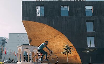 Biking in Tirana, Albania. Unsplash:Alexandr Bormotin