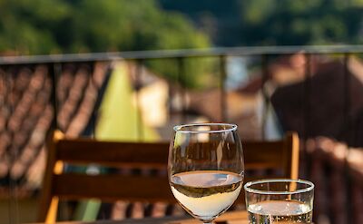 Drinking Portuguese wine on a terrace. Unsplash@Thimo van Leeuwen