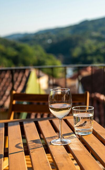 Drinking Portuguese wine on a terrace. Unsplash@Thimo van Leeuwen