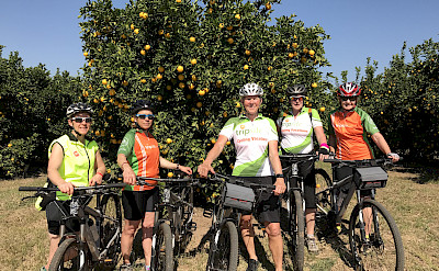Hennie and crew biking through the orchards in gorgeous South Africa!