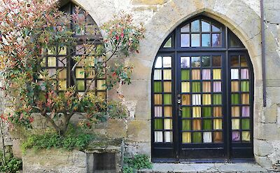 Stained glass in Cordes-sur-Ciel, France. Unsplash:Benjamin Dehant