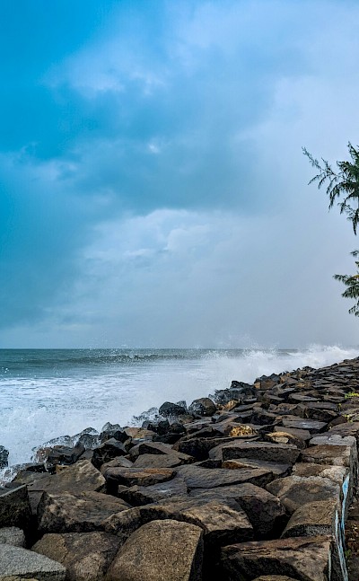 Bike tour by the sea in Kochi, India. Unsplash@Ajith