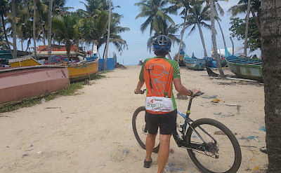 Hennie taking a bike rest among the boats of Kerala, India. 