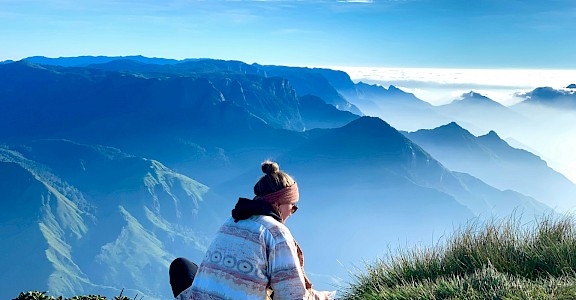 Pausing for a snack in Munnar, Kerala bike tour, India. Unsplash@Arnold Antoo