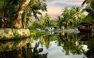 River scenes in Alleppey, Kerala bike tour, India. Unsplash@Tim Broadbent