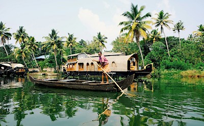 Traditional boats in Munnar, Kerala bike tour, India. Unsplash@Kyran Low