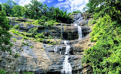 Waterfall in Munnar, Kerala bike tour, India. Unsplash@Arif Khan