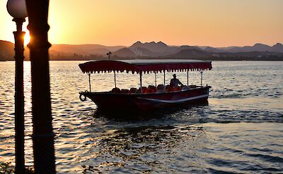 Boat on Lake Pichola at sunset, Udaipur. Unsplash@Udayaditya Barua