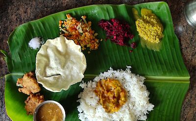 Indian food ingredients laid out on leaves. Unsplash@Saktheeswaran Govindarajan