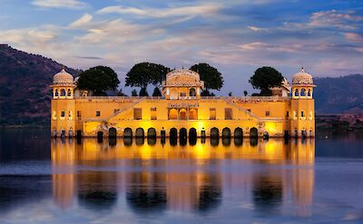 Palace on the lake illuminated at night, Jaipur. Unsplash@Getty Images