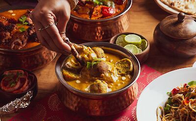 Pots of Indian curries. Unsplash@Perspective Studio
