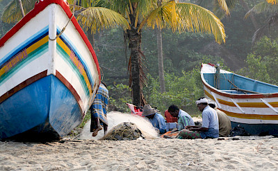 Fixing fishing nets in Kerala, India. Flickr:Andy Kaye