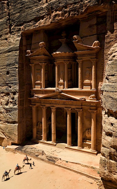 Camels walking towards Petra, Jordan. Unsplash@Dylan Shaw
