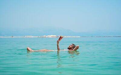 Floating in the Dead Sea, Israel. Unsplash:Toa Heftiba
