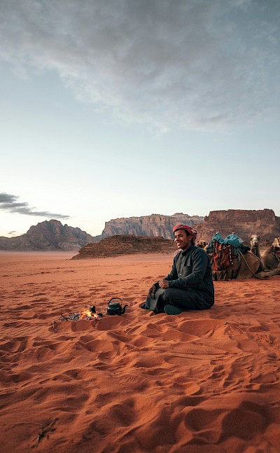 Local man making tea in the Wadi Rum desert, Jordan. Unsplash@Spencer Davis