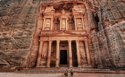Men standing at the entrance to Petra, Jordan. Unsplash@Brian Kairuz