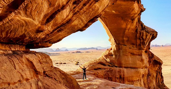 Standing in an arch in Wadi Rum, Jordan. Unsplash@Lior Dahan