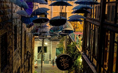 Umbrellas hanging over a street in Amman, Jordan. Unsplash@Jan Simons