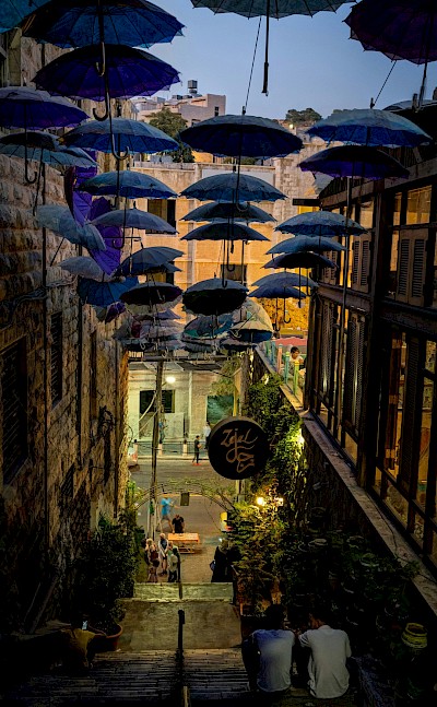 Umbrellas hanging over a street in Amman, Jordan. Unsplash@Jan Simons